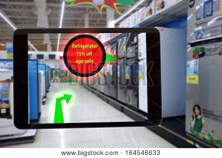 internet of things marketing conceptssmart augmented realitycustomer hold the tablet to see the product that show the special price and promotion to save money and the walk path to go the product