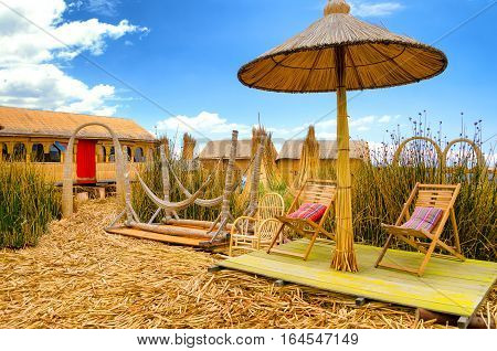 Chairs and hammocks on a man made floating island on Lake Titicaca in Peru