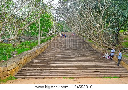 MIHINTALE SRI LANKA - NOVEMBER 26 2016: The long stone staircase leads to the Mihintale Monastery Complex located on the top of Mahinda's Hill on November 26 in Mihintale.