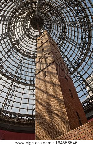Melbourne Australia - February 2015: Melbourne's Shot Tower which was built on the site in 1888 is an iconic building contained underneath a massive glass dome at the Melbourne Central shopping centre
