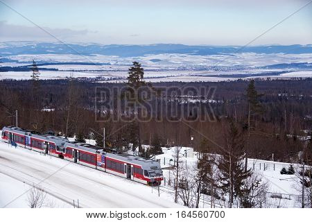 SLOVAKIA HORNY SMOKOVEC - JANUARY 05 2015: High speed electric train arrived on the railway station in Horny Smokovec. Is a ski village located in the High Tatras at an altitude of 950 m a.s.l.