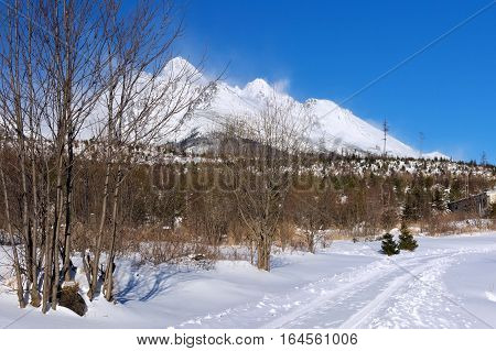 View of the High Tatras mountains with the peaks covered with snow from Horny Smokovec. Is a ski village located in Slovakia at an altitude of 950 m a.s.l.