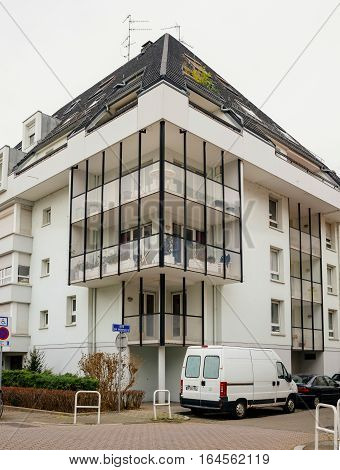 sTRASBOURG FRANCE - DEC 2 2016: French apartment real estate building with white van parked in front
