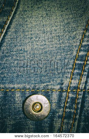 Blue jeans texture background and button and seam