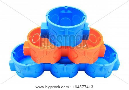Stack Of Blue And Orange Electrical Boxes. White Background