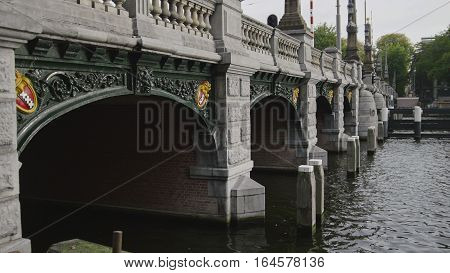 AMSTERDAM, THE NETHERLANDS - 18 october 2016: famous bridge on Sarphatestraat with symbols of city - triple x, close up
