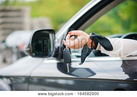 Car Keys. Seller woman hand giving keys