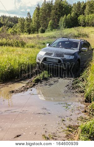 Karelia, Russia, July 15, 2014, Mitsubishi Pajero sport on off-road expeditions in Karelia, Mitsubishi Pajero is a compact four wheel drive off road and sport utility vehicle