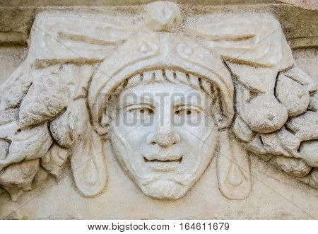 Aydin, Turkey - October 9, 2015: Portrait sculpture detail on a Greek ruin in Aphrodisias, Turkey.