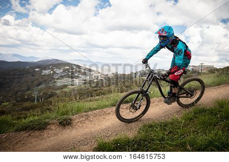 Mt Buller, Australia - January 4, 2017: Downhill mountain bike riders attempt the ABOM and International tracks on January 4, 2017 in Mt Buller, Australia