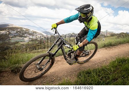 Mt Buller, Australia - January 4, 2017: Downhill mountain bike riders attempt the ABOM and International tracks on January 4, 2017 in Mt Buller, Australia