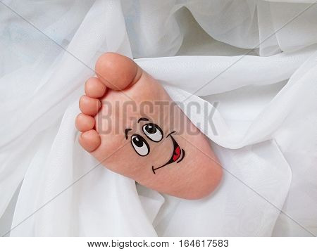 Funny Baby feet wrapped in white cloth