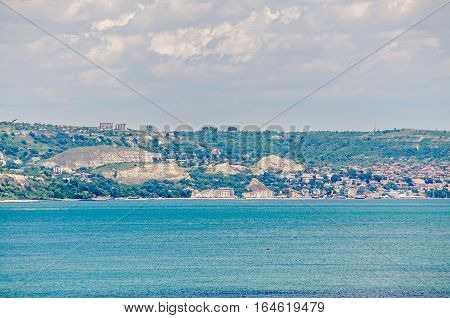 Albena, Bulgaria - June 13, 2016. View Of The Black Sea Shore, Green Hills With Houses, Blue Clouds