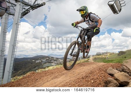 Mt Buller, Australia - January 4, 2017: Downhill mountain bike riders attempt the ABOM and International tracks on January 4, 2017 in Mt Buller, Australia