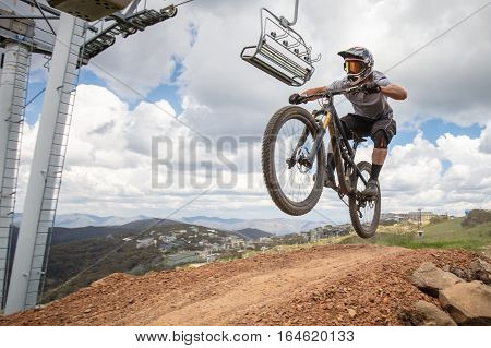 Mt Buller, Australia - January 4, 2017: Downhill mountain bike riders attempt the ABOM and International tracks on January 4, 2017 in Mt Buller, Australia