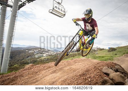 Mt Buller, Australia - January 5, 2017: Downhill mountain bike riders attempt the ABOM and International tracks on January 5, 2017 in Mt Buller, Australia