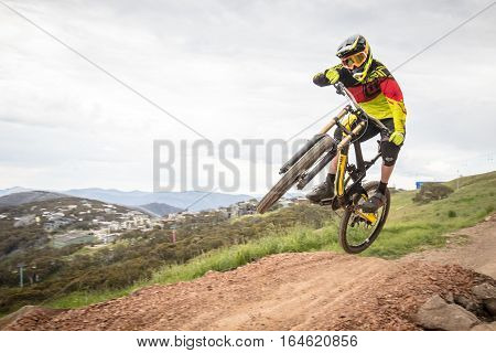 Mt Buller, Australia - January 5, 2017: Downhill mountain bike riders attempt the ABOM and International tracks on January 5, 2017 in Mt Buller, Australia