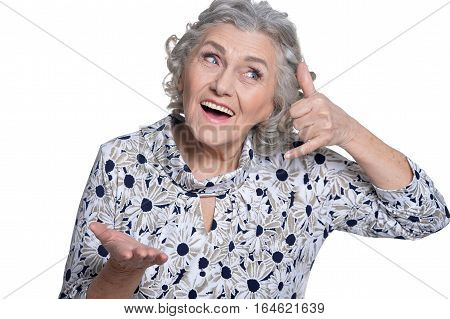 portrait of beautiful mature woman, posing against white background