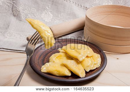 Close Up View Of Boiled Varenyky Or Dumpling With Cottage Cheese Or Curd On Metal Fork. Fresh Boiled