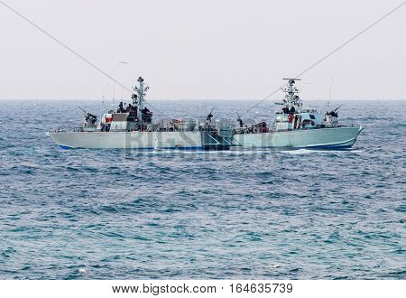 All-weather patrol boats patrol on a cloudy day near the shore of the sea space of the country