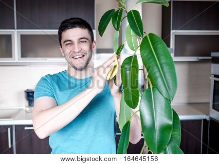 Adult Man Cleaning Pipal In Kitchen