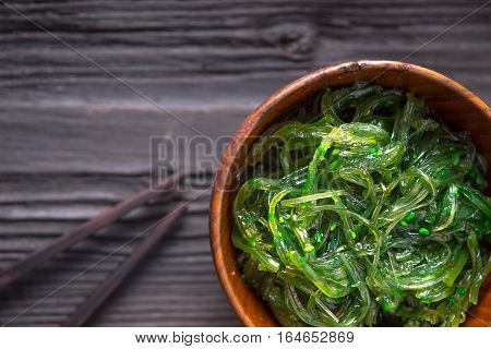 Chuka salad in the wooden bowl top view