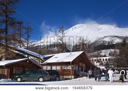 View of the High Tatras mountains with the peaks covered with snow from center of Stary Smokovec. Is a popular resort in Slovakia for skiing and hiking at an altitude of 990 m a.s.l.