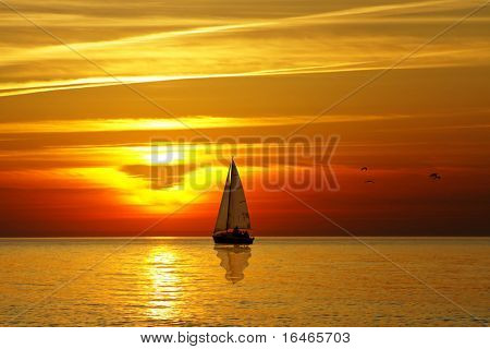 Vela e pôr do sol