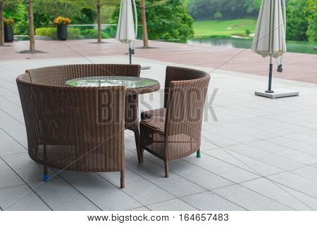 rattan sofa and table set in a garden