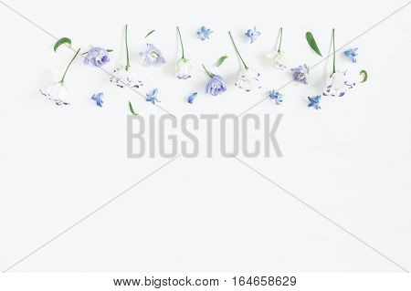 Flowers composition. Border made of lilac and white flowers. Flat lay top view