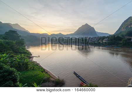 Sunset over the Ou River bisecting the town of Nong Khiaw in nothern Laos