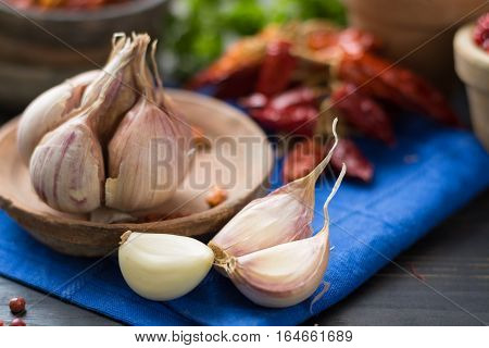 French garlic and red hot chili cayenne peppers dried variety - spicy ingredient on wooden table