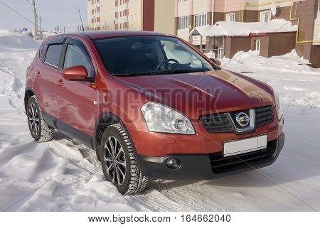 Nissan Qashqai in red color. This is crossover that combines modark design and compact hatchback refinement with functionality