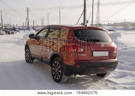 Nissan Qashqai in red color. This is crossover that combines modark design and compact hatchback refinement with functionality