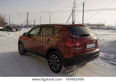 Nissan Qashqai in red color. This is crossover that combines modark design and compact hatchback refinement with functionality