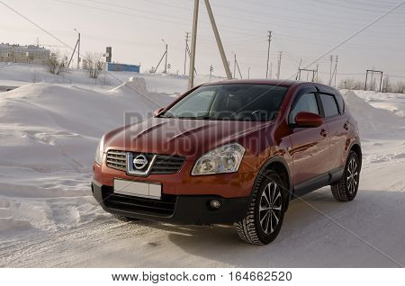 Nissan Qashqai in red color. This is crossover that combines modark design and compact hatchback refinement with functionality