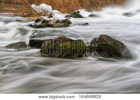 Autumn river view with waterfall on the river Kalmius located in Donetsk region