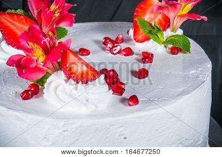 Delicious cake on a wooden black background