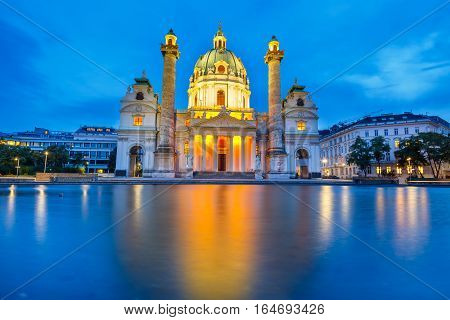 Night View Of Famous Saint Charles's Church At Karlsplatz In Vienna, Austria