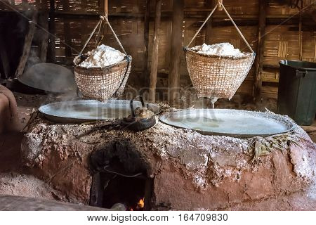 Traditional salt making by boiling underground salt water. Nan province Thailand.