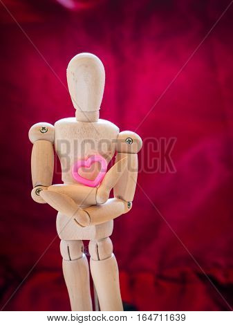 Still Life Wooden Puppet And Pink Heart.