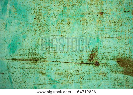 The old metal blue wall with rust.