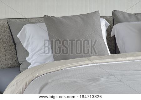 Gray Pillow On White Setting On Bed With Comfy Blanket