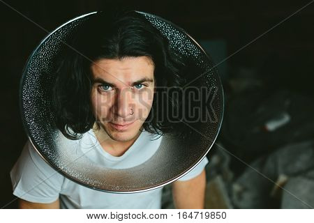 Male model wearing fooling around his neck reflector diffuser. Dog Recovery Collar Cones