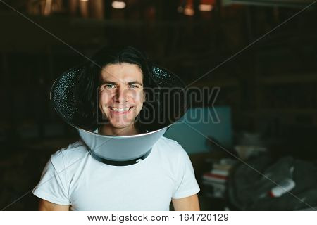 Male model wearing fooling around his neck reflector diffuser. Dog Recovery Collar Cones