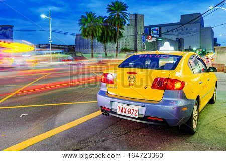 KEELUNG TAIWAN - NOVEMBER 28: This is a yellow taxi in Keelung city at night thes same Taxis are used in all Taiwanese cities on November 28 2016 in Keelung