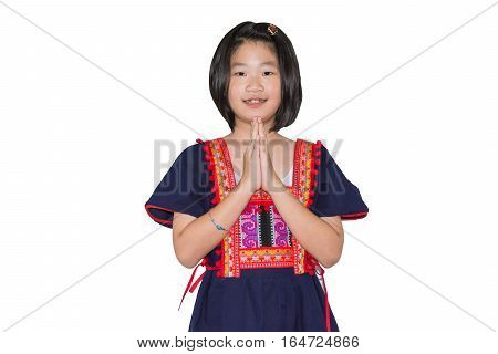 kid in hill tribe costume welcome pose Thai style sawadee on white