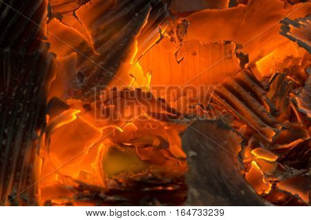 smoldering fire embers with the ashes background