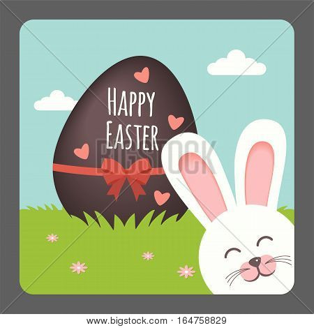 Happy Easter with bunny smiling and chocolate egg on spring background
