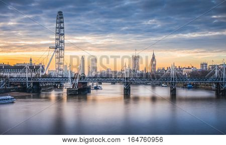 London skyline toward embakment bridge and big ben as seen from waterloo bridge at sunrise